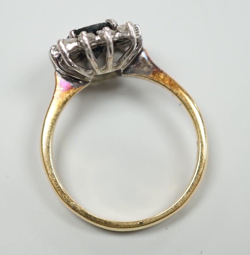 An 18k yellow metal, sapphire and diamond set rectangular cluster ring, size M, gross 4 grams.